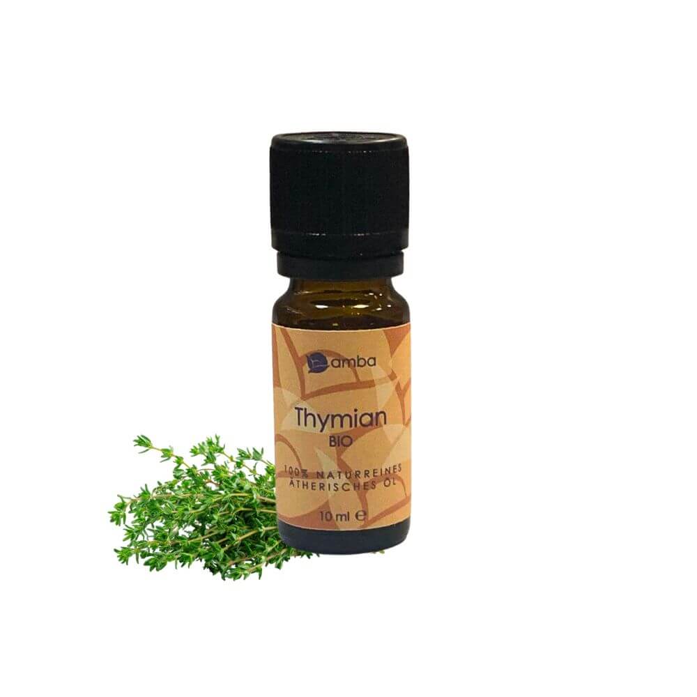 Thymian Ätherisches Öl mit Thymian im Hintergrund