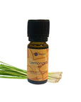 Ätherische Ölflasche  amba Lemongras Bio. Lemogras im Hintergrund